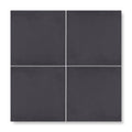 Four matte black porcelain patisserie dark base tiles arranged in a square grid for flooring or walls