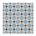Patisserie hevin blue patterned ceramic tile with blue and white geometric design and black star accents