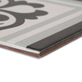 Patisserie sucre corner patterned ceramic tile with a gray and black pattern and a glossy finish