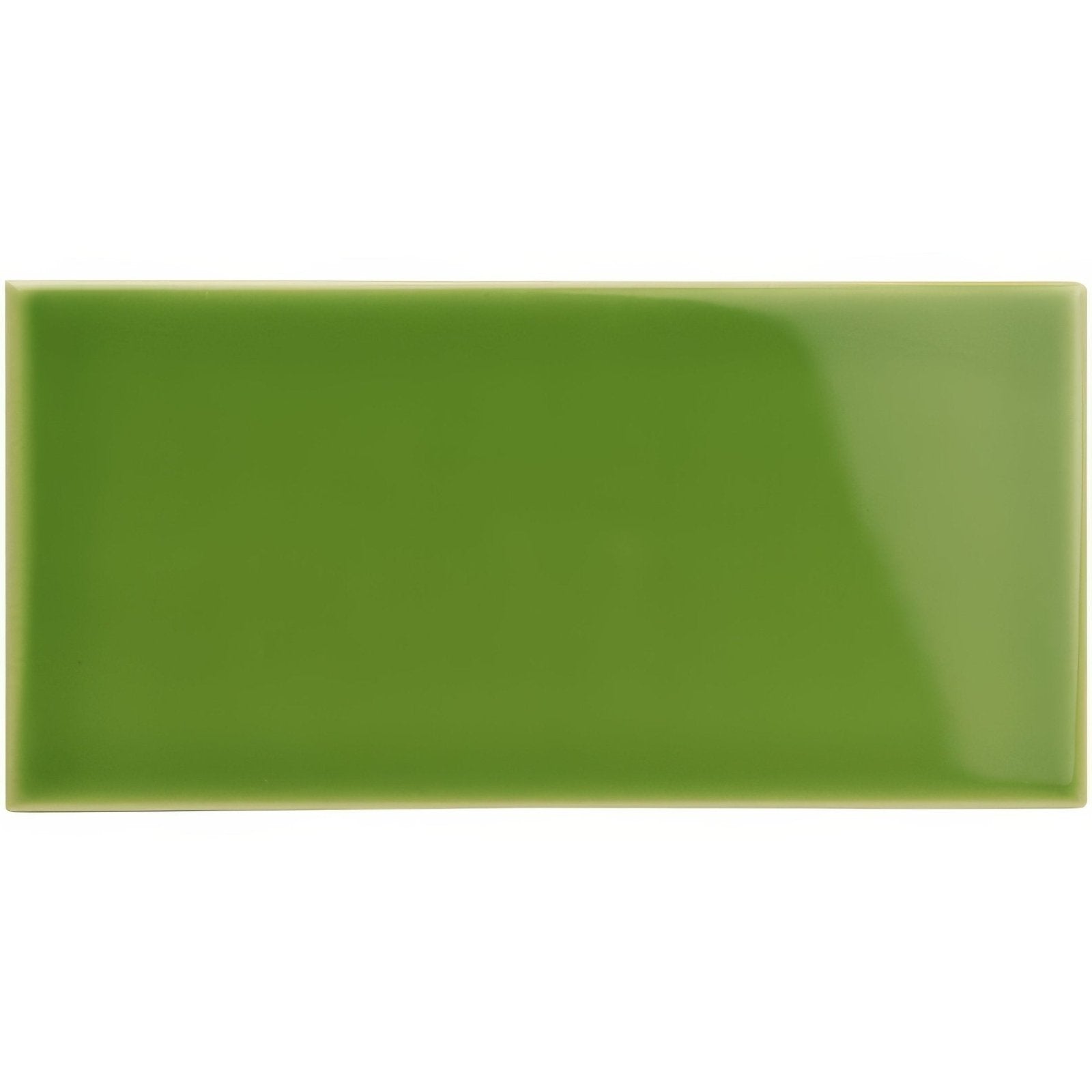 A glossy rectangular green ceramic pavilion green half tile with smooth surface and slightly rounded edges