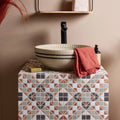 Pavilion Porcelain Russet Red geometric porcelain mosaic with a beige striped vessel sink