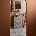 Pavilion Porcelain Russet Red geometric porcelain mosaic with a white striped bowl sink