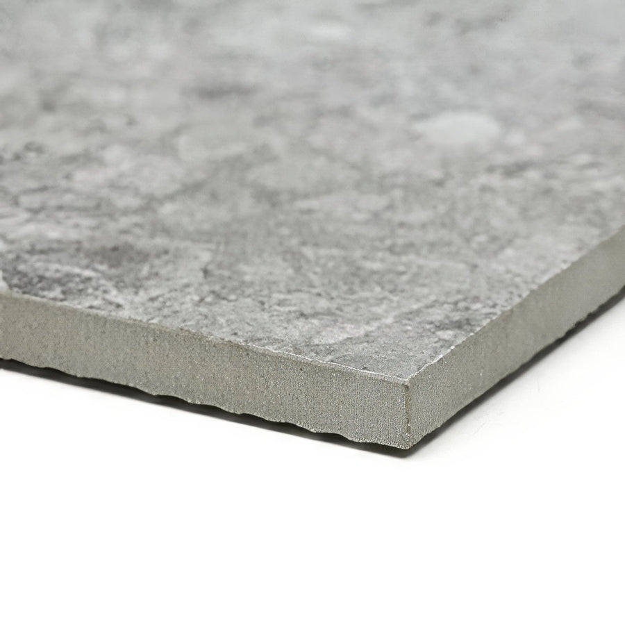 Grey stone-effect tile pebble beach grey 120 x 60cm with textured mottled surface and slightly rough-edged profile