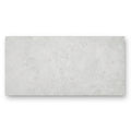 A rectangular light gray concrete-effect tile with textured surface pebble beach white 120 x 60cm