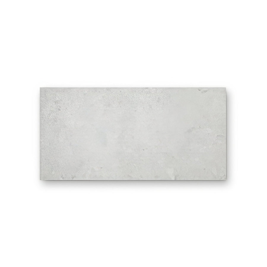 Pebble Beach White rectangular light gray concrete tile with subtle texture and faint veining 60 by 30 cm
