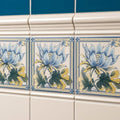 Peony single tile ceramic with blue and yellow floral pattern and decorative borders on county white background