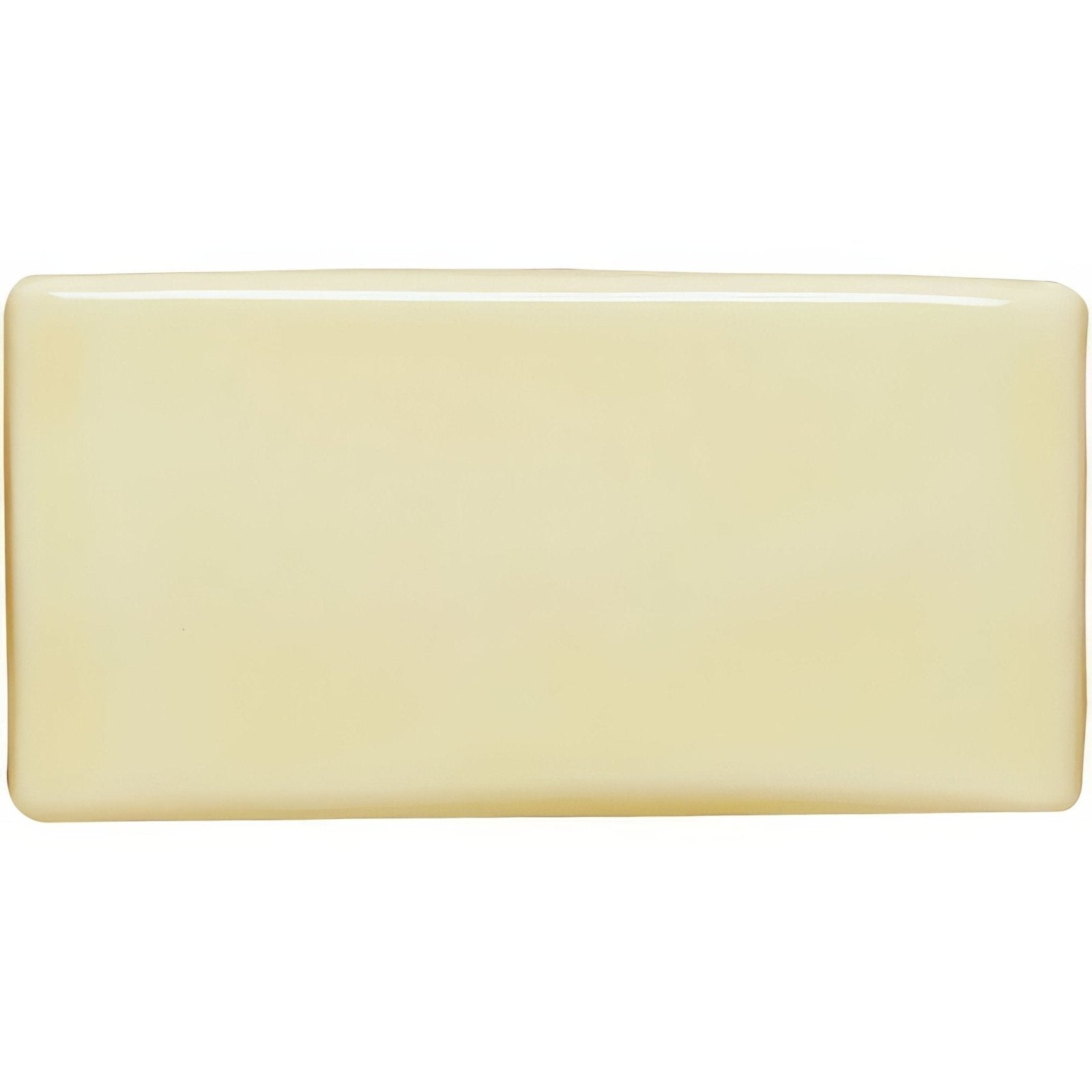 Cream-colored peridot half tile with smooth glossy finish in a rectangular bar shape for wall or backsplash use