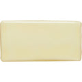 Cream-colored peridot half tile with smooth glossy finish in a rectangular bar shape for wall or backsplash use
