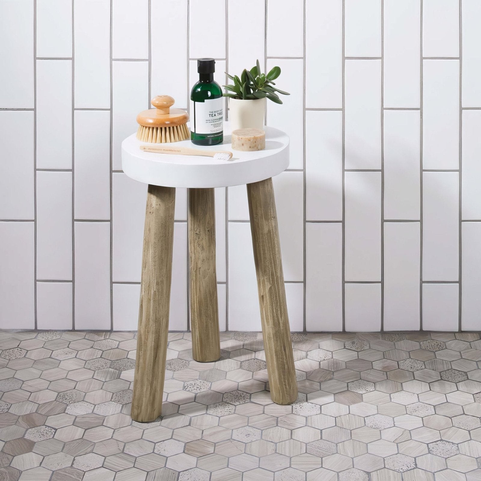 White round table with three rustic wooden legs paired with perla large hexagon stone mosaic surface design