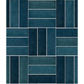 Petite porcelain gloss blue rectangular ceramic tiles in teal and navy blue arranged in a herringbone pattern with white grout lines