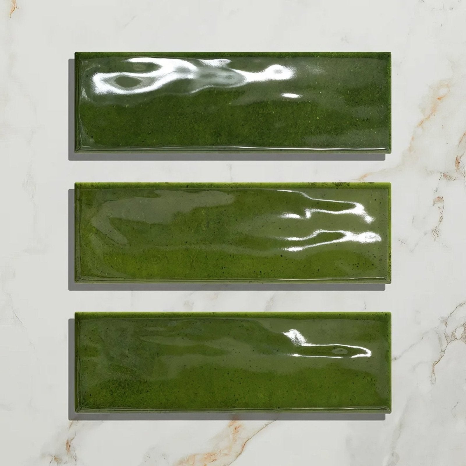 Three glossy olive green rectangular ceramic tiles arranged vertically from petite porcelain gloss olive collection