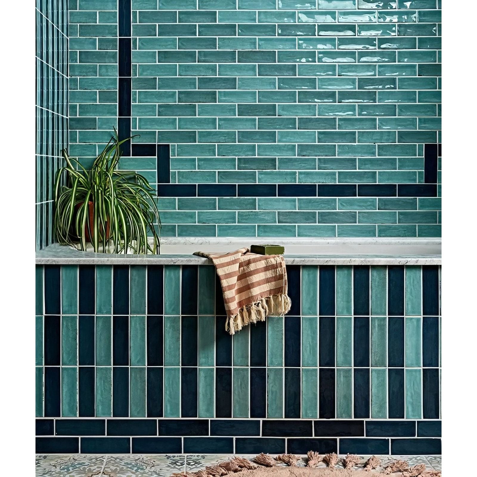 Petite porcelain gloss sky subway tiles with glossy teal and navy blue finish arranged in alternating horizontal rows