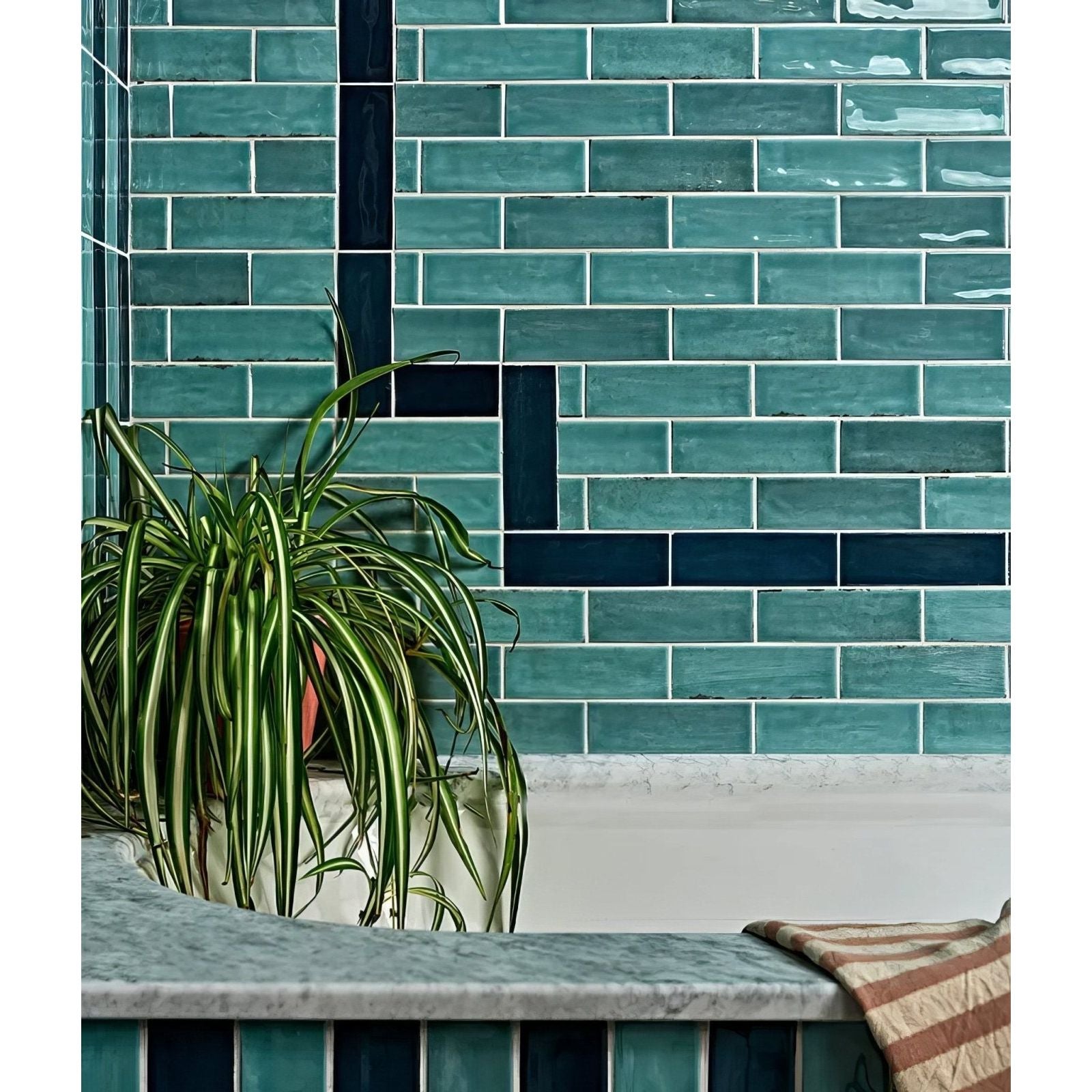 Petite porcelain gloss sky tiles featuring teal and navy blue glossy subway tiles with a modern geometric pattern