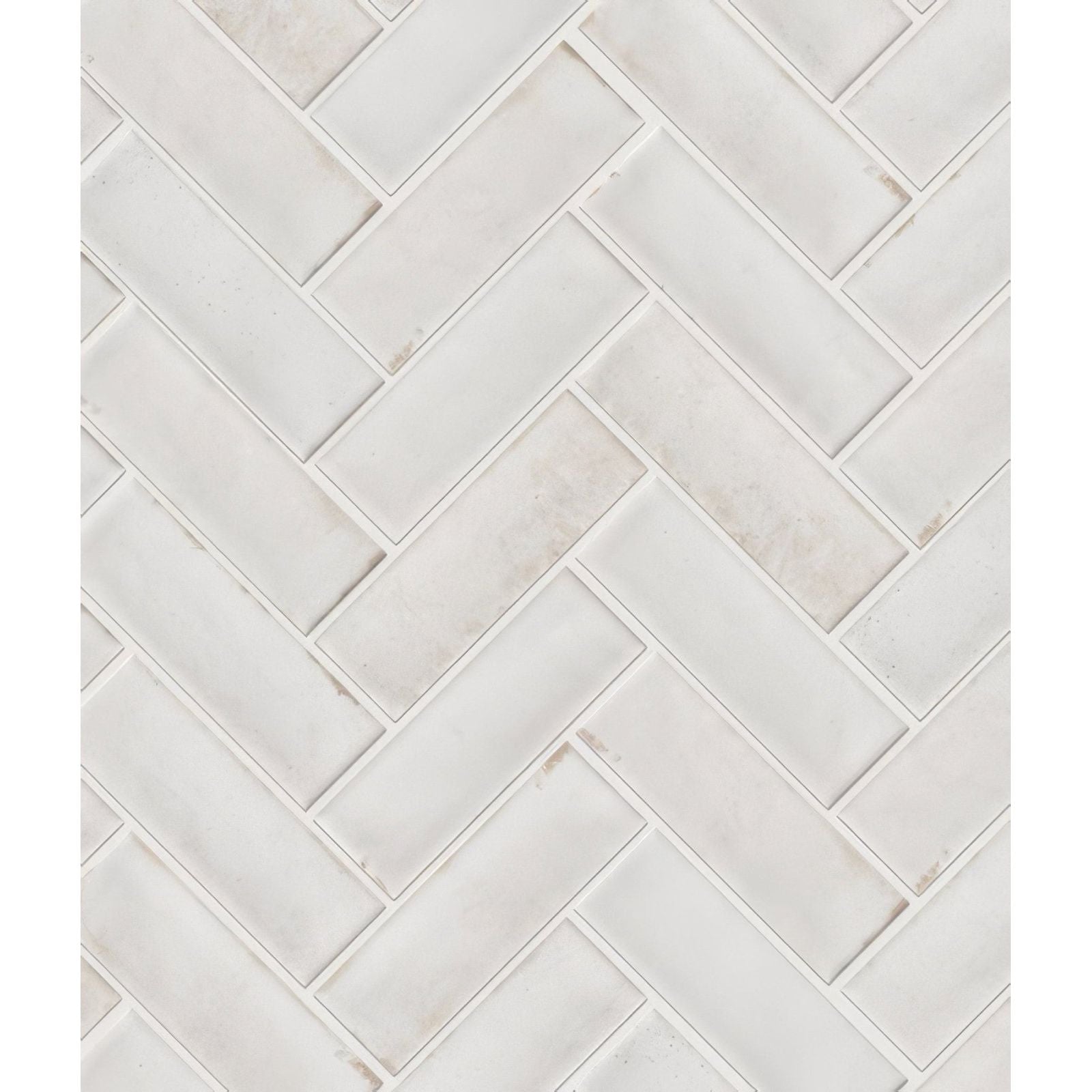 Petite porcelain gloss white marble subway tile with subtle veining arranged in a herringbone layout