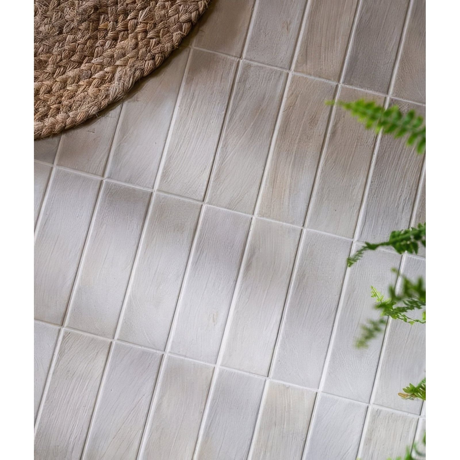 Light gray petite porcelain matt cotto tiles with subtle wood grain texture arranged in vertical rows