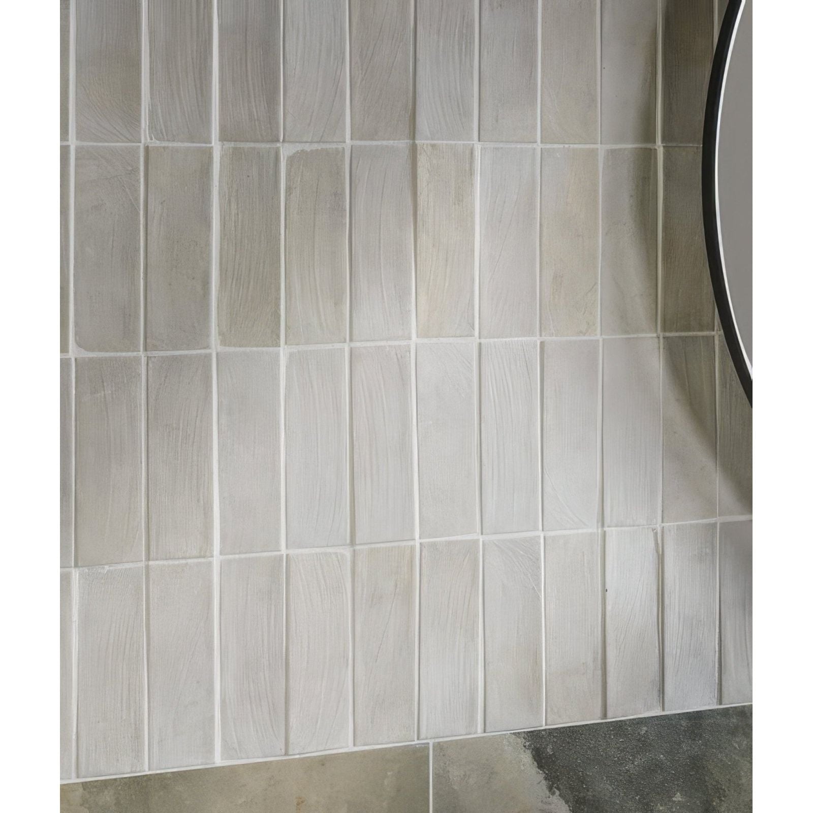Gray rectangular petite porcelain matt cotto light tiles with subtle wood-grain texture arranged in vertical rows