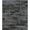 Dark gray petite porcelain matt graphite tiles with textured weathered concrete finish in staggered brick pattern