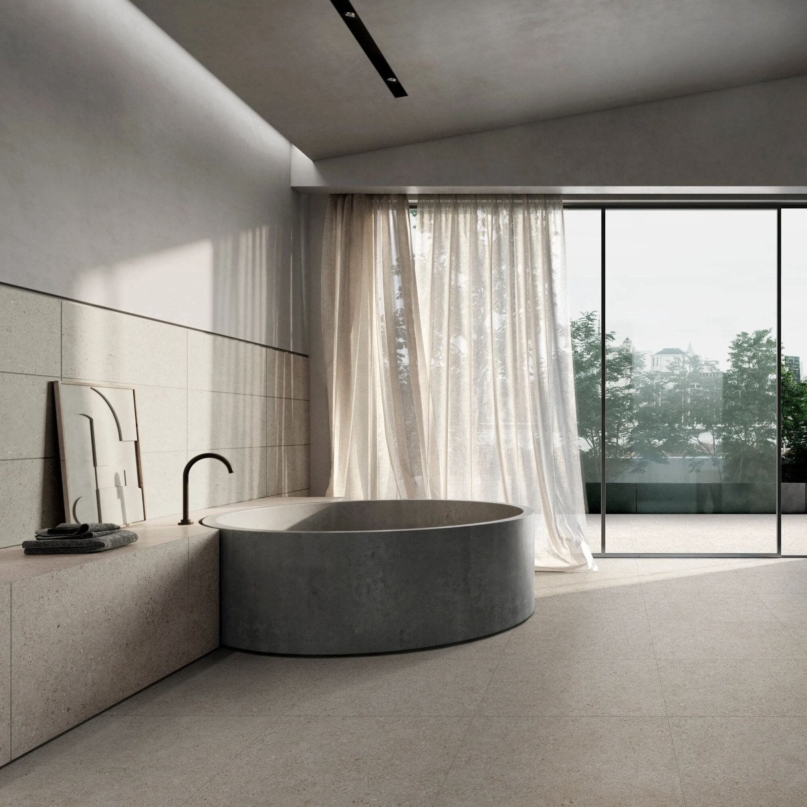 A sleek round concrete bathtub piazza silver 60 x 60cm with minimalist design and matte gray finish