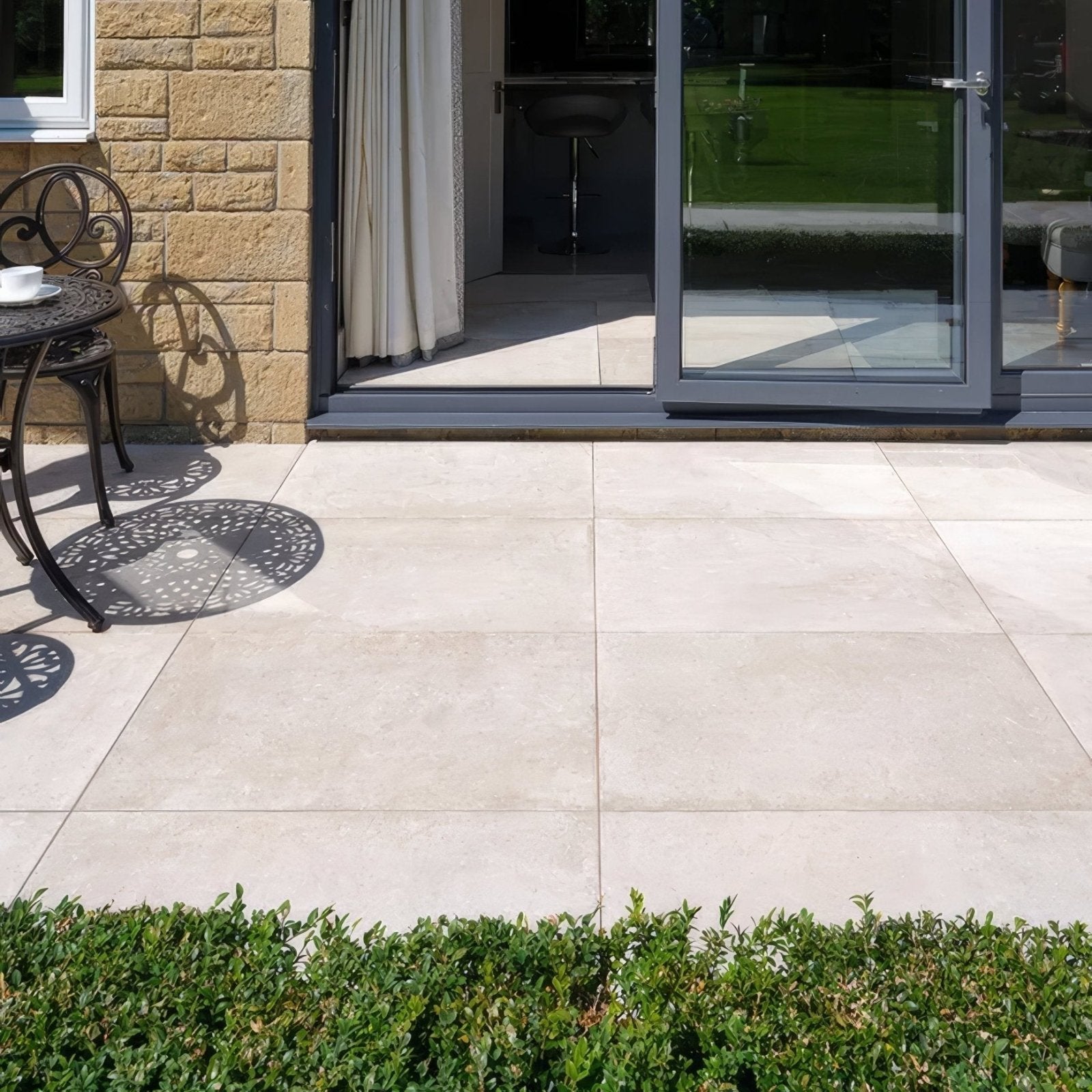 Pierre porcelain paving beige stone patio tiles with subtle natural texture and uniform rectangular shape