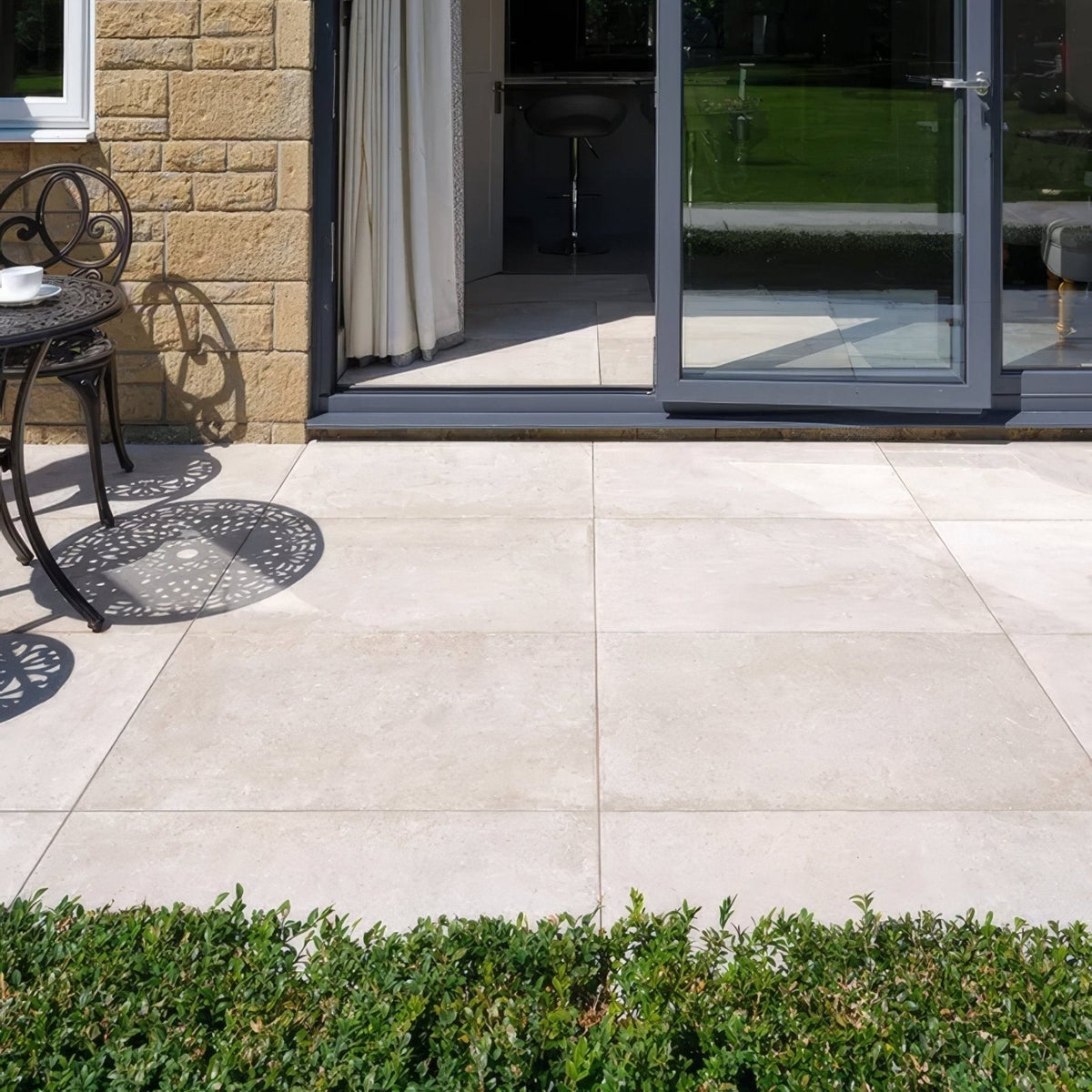 Pierre porcelain paving beige stone patio tiles with subtle natural texture and uniform rectangular shape
