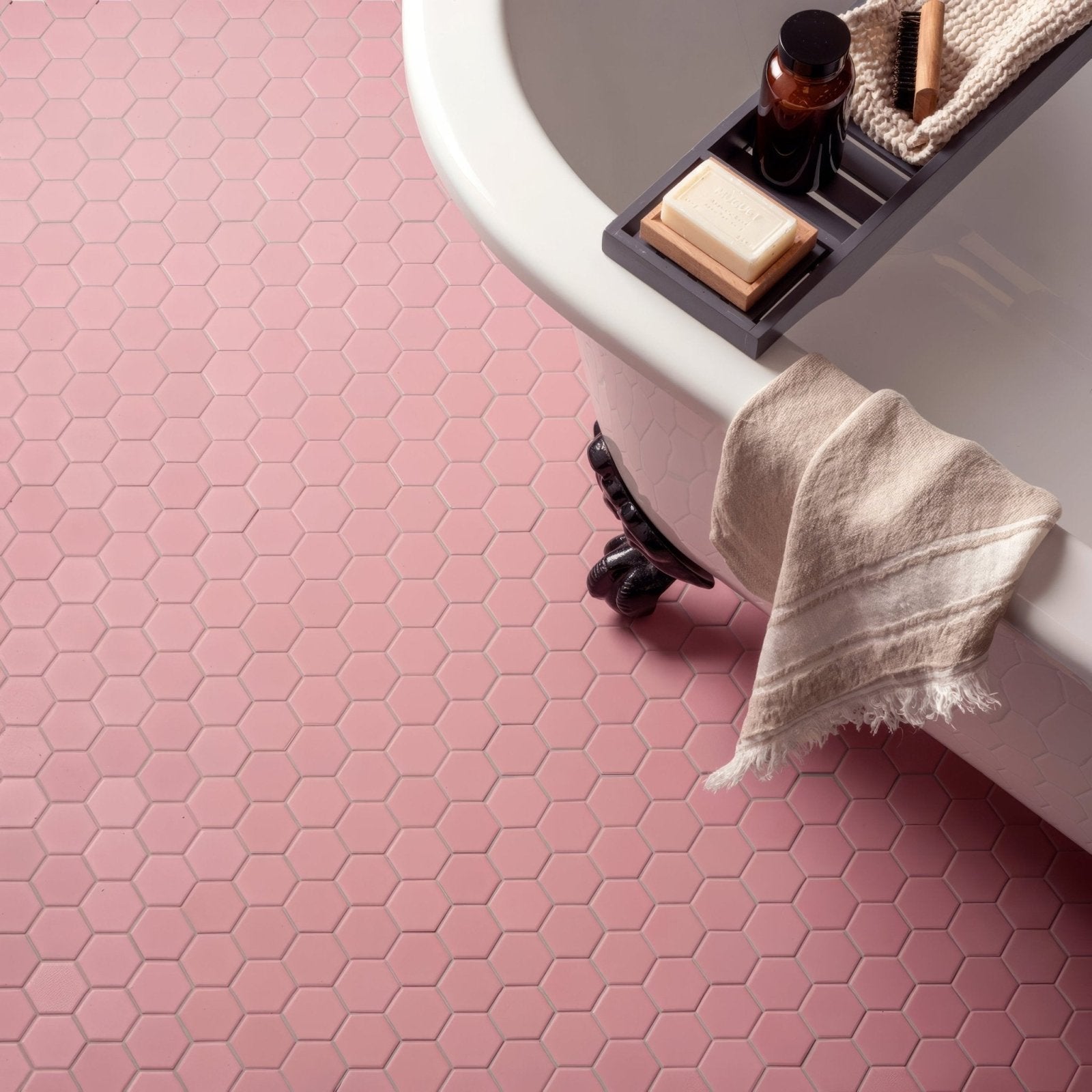 Pink hexagon slip resistant tile flooring with a textured surface for enhanced safety and stylish decor