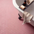 Pink hexagon slip resistant tile flooring with a textured surface for enhanced safety and stylish decor