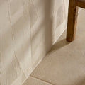 Cream-colored plastercraft calco porcelain sabbia textured wall panel with raised geometric diamond pattern