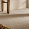 Beige stone-effect plastercraft calco porcelain sabbia textured floor tiles with subtle texture and thin grout lines