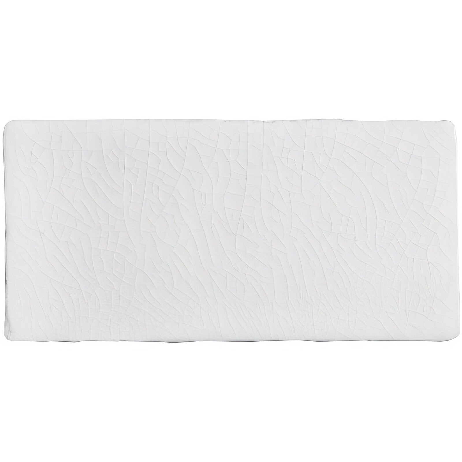 White rectangular mattress topper with a subtle textured surface for use on half tile porcelain floors