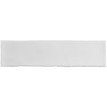 White rectangular cushion with smooth slightly textured surface complementing large brick tile porcelain design
