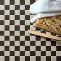 Porcelain Square White & Black black and white porcelain mosaic with a towel on a bamboo basket