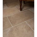 Buscot blend limestone tumbled finish beige stone tiles with natural texture and subtle tone variations in staggered layout