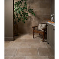 Beige rectangular buscot blend limestone tiles with tumbled finish and subtle natural variations with light grout lines
