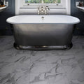 Butler Porcelain Calacatta white and grey marble-effect porcelain tiles with a freestanding bathtub