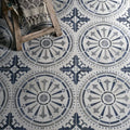 Canero ceramic matt floor tiles in blue and gray with ornate circular patterned ceramic design