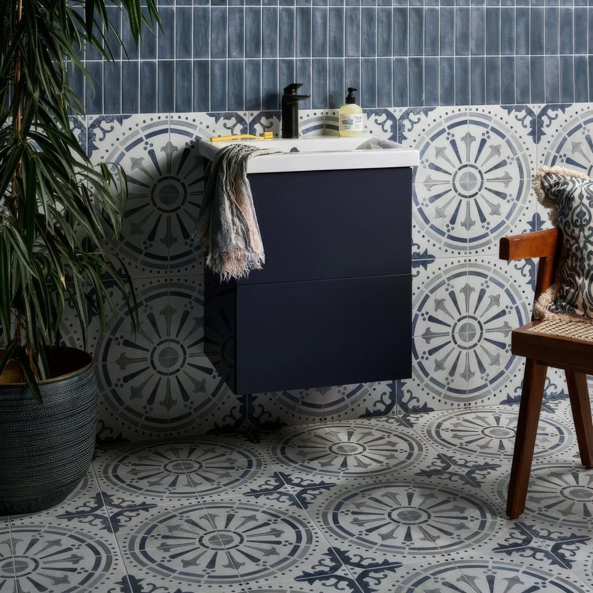 Navy blue floating bathroom vanity with white ceramic matt countertop and two drawers in canero style