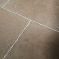 Beige cotswold porcelain matt stone tiles with subtle texture and white grout lines for flooring and walls