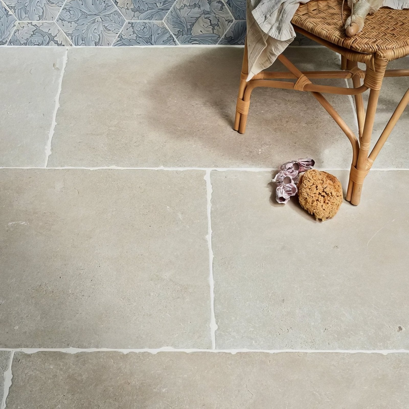 Cotswold porcelain matt light gray stone tiles with subtle natural texture and white grout lines