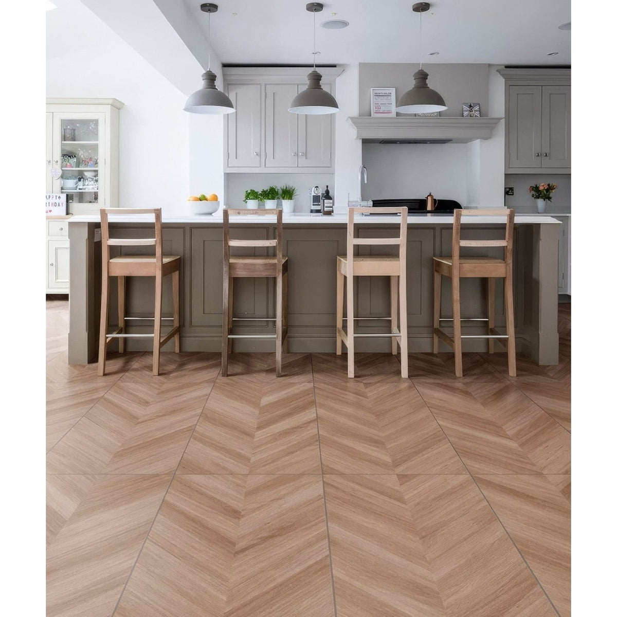 Light brown herringbone patterned davos chevron porcelain matt floor tiles with a textured matt finish