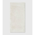 Cream-colored rectangular ceramic tile with subtle stone texture and faint veining dorset porcelain white 60 x 120cm