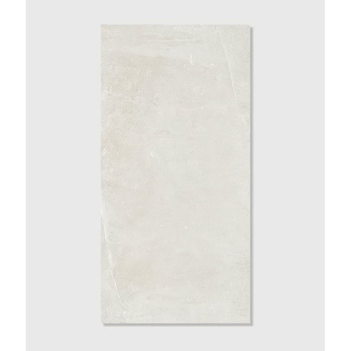 Cream-colored rectangular ceramic tile with subtle stone texture and faint veining dorset porcelain white 60 x 120cm