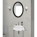 Black oval mirror with sleek glossy frame paired with dorset porcelain white 60 x 120cm tile display