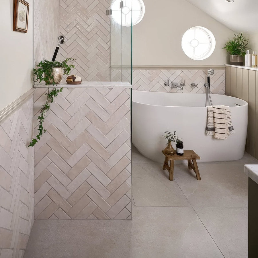 White freestanding porcelain bathtub dorset with curved design and chrome fixtures in 80 x 80cm size