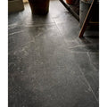 Etna porcelain matt floor tiles 59.5x59.5cm dark gray marble with subtle white veining and polished surface