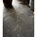 Etna porcelain matt tile 59.5x59.5cm in dark gray stone with subtle white veining and speckled texture