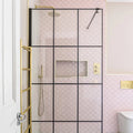 Gelato Porcelain Mosaic Cotton Candy pink scalloped porcelain mosaic with a gold-framed glass shower enclosure