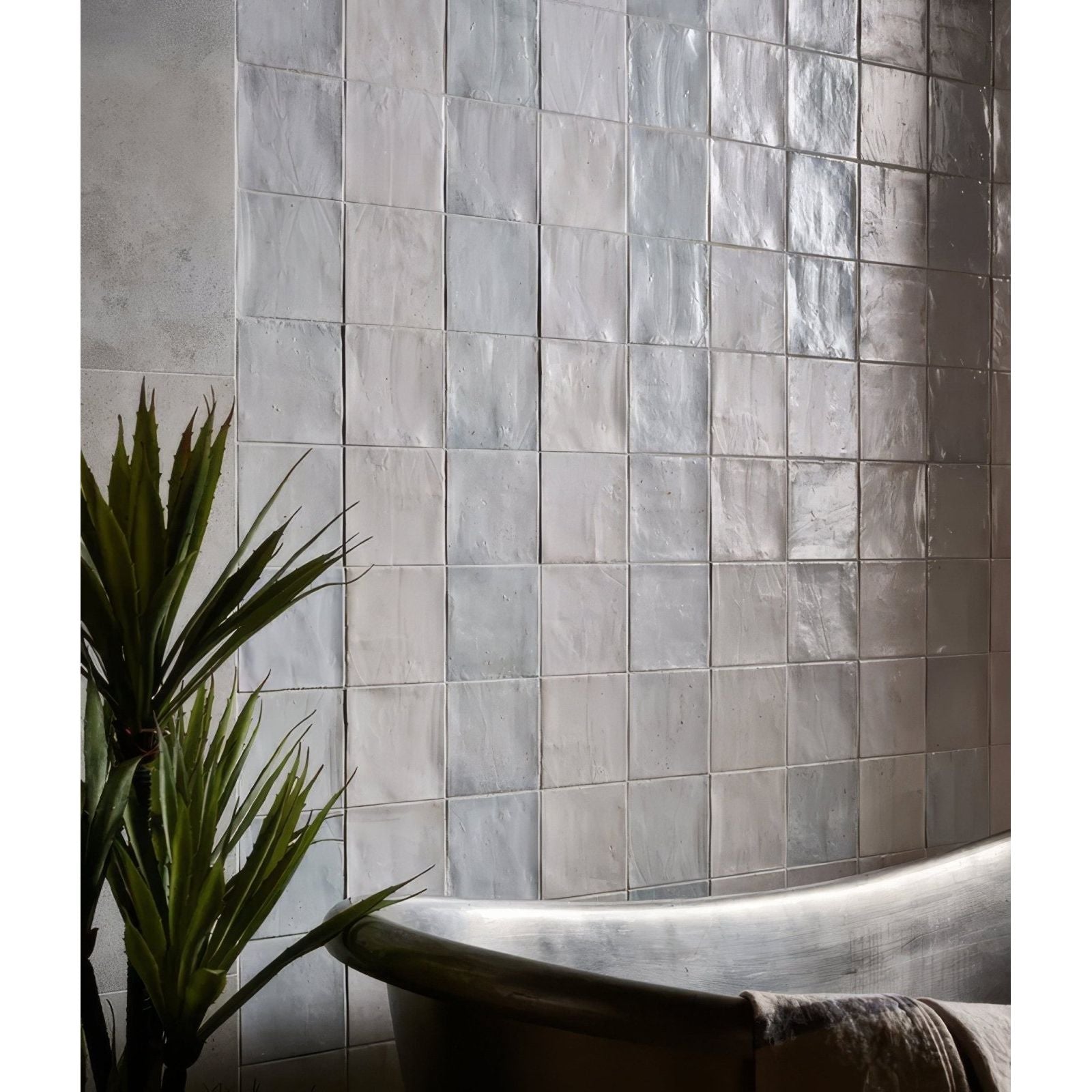Silver metallic square hammam ceramic blue tiles with subtle textured finish covering the wall