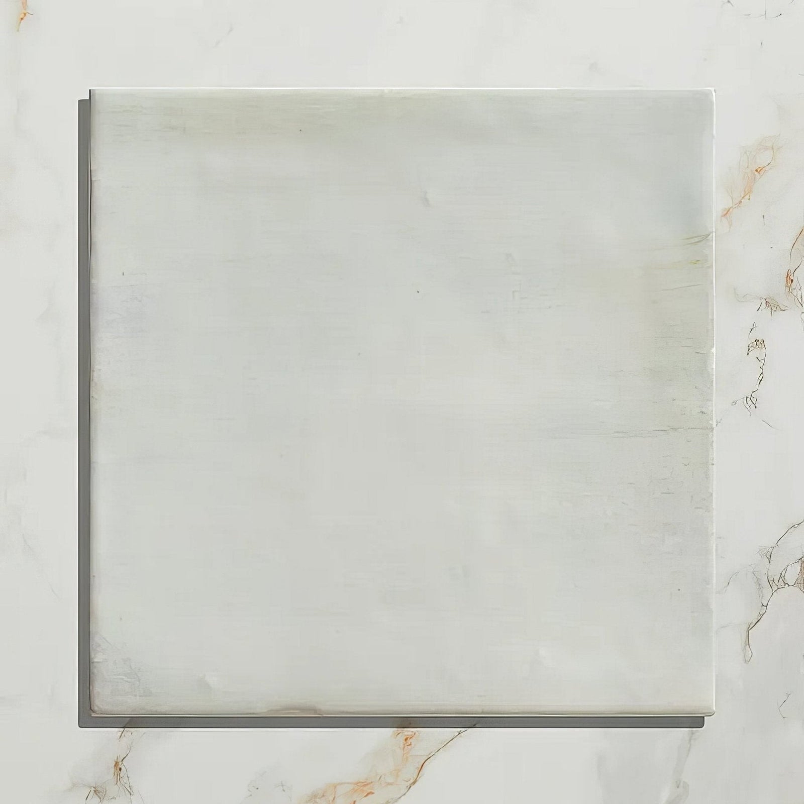 Square white marble tile with subtle veining and polished surface from hammam ceramic blue collection