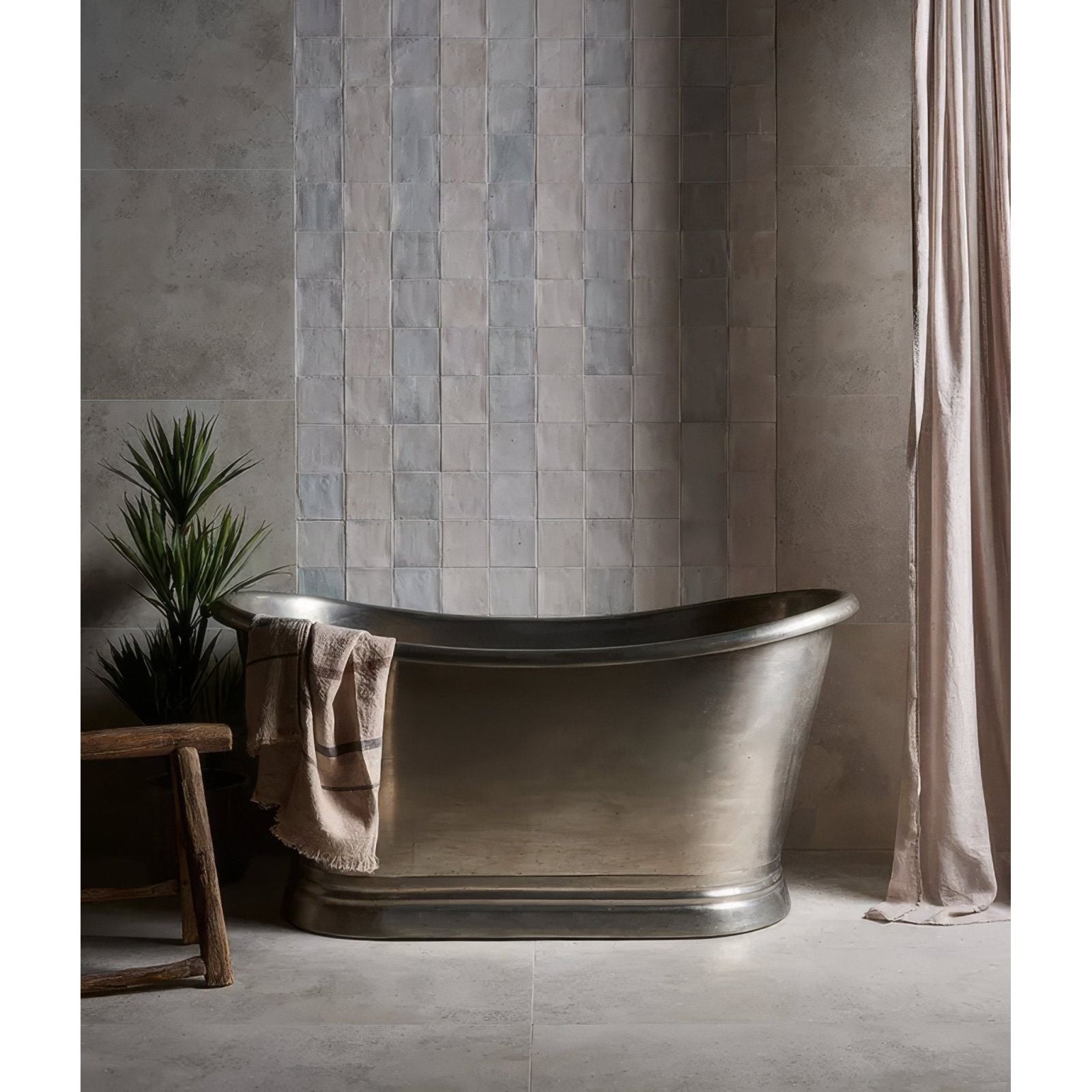 Antique silver-finished freestanding hammered oval bathtub in ceramic white for classic bathroom elegance