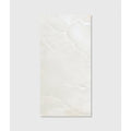 A sleek rectangular white marble illusion Whisper Onyx porcelain polished mist tile with subtle veining and glossy finish